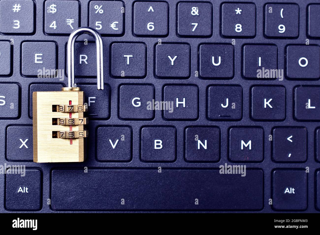 computer security. Unlocked padlock on a laptop`s keyboard. Stock Photo